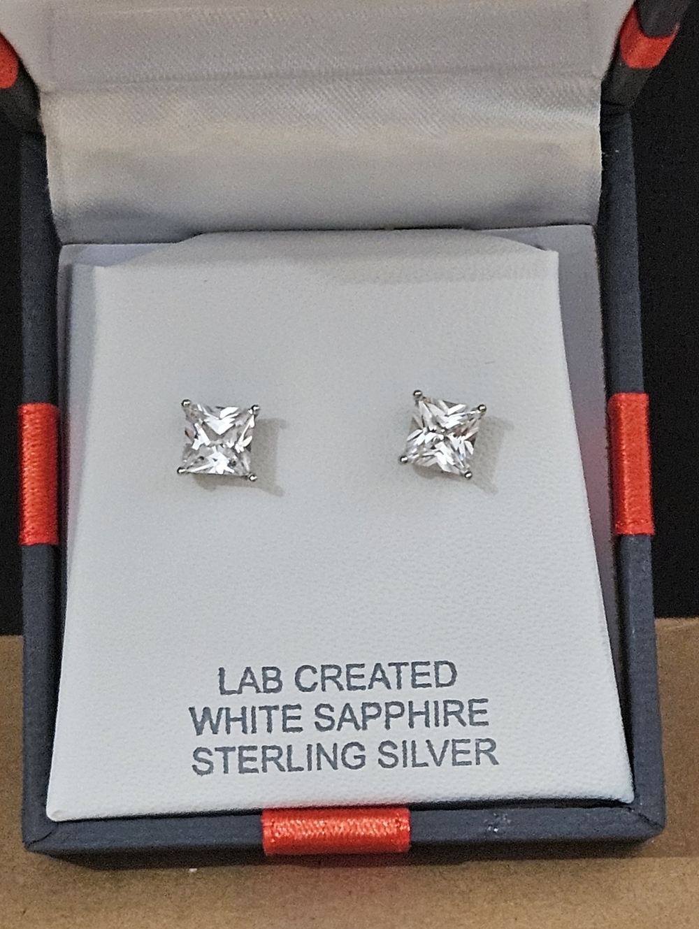 Sterling silver lab created white sapphire earrings. New